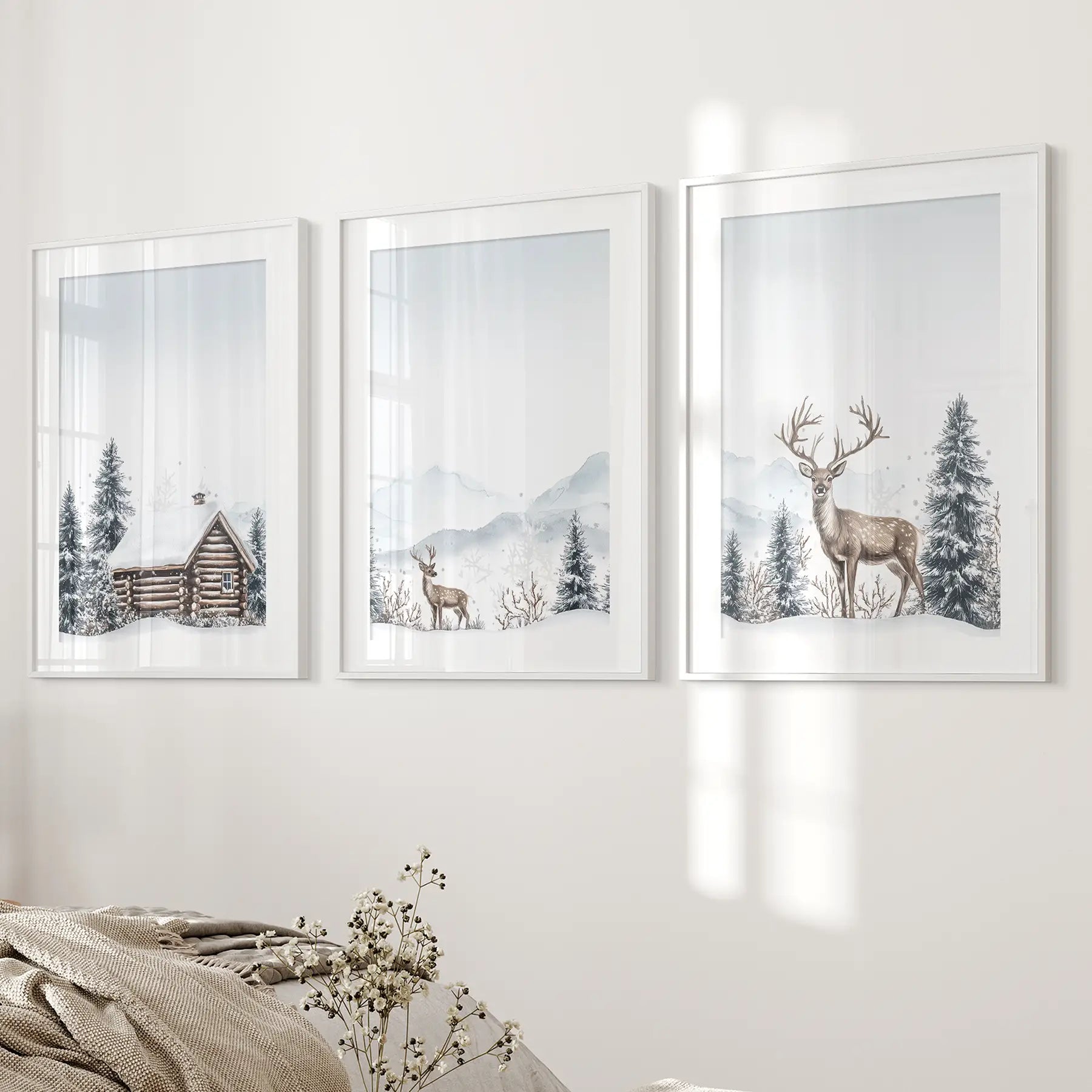 Woodland deer wall art set of 3, holiday home decoration. White frames with mat above the bed.
