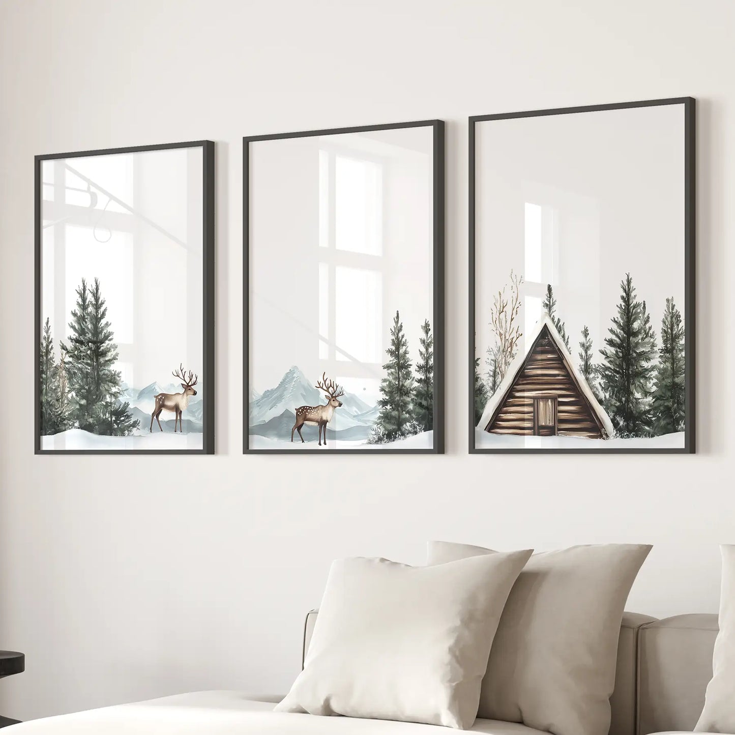 Lodge inspired rustic cabin wall decor. Snowy pine forest posters. Black frames above the sofa.