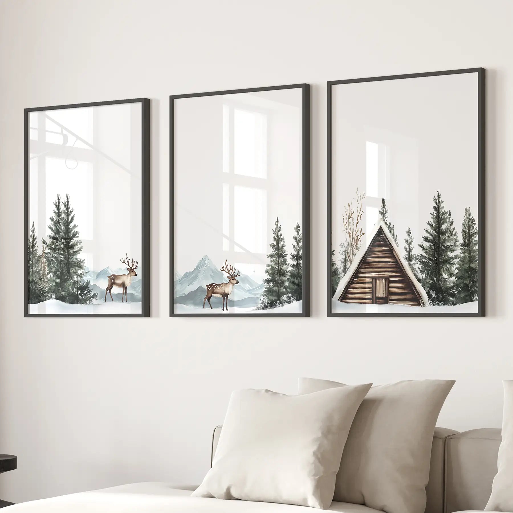 Lodge inspired rustic cabin wall decor. Snowy pine forest posters. Black frames above the sofa.