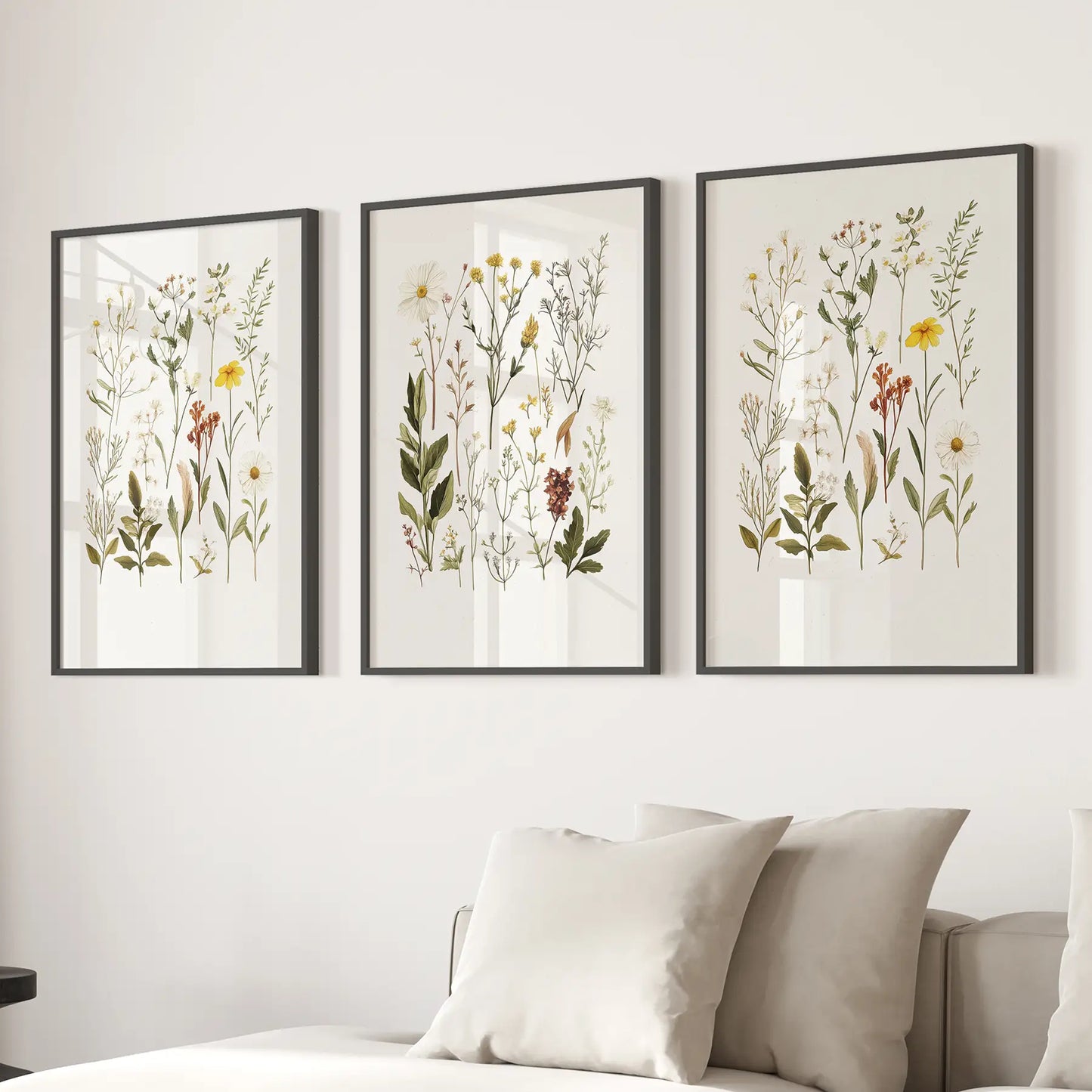 Girl nursery decoration. Modern flowers wall art prints. Black frames above the sofa.