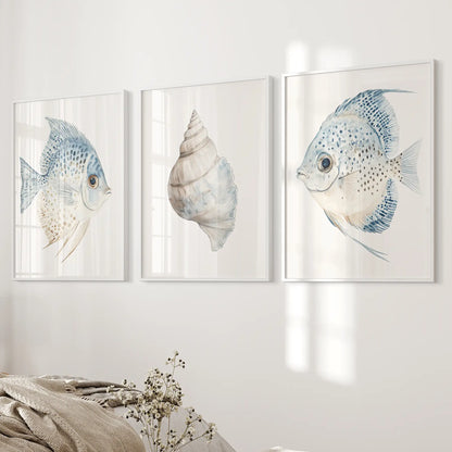 Watercolor painting large ocean posters. Pastel shell print set. White frames over the bed.