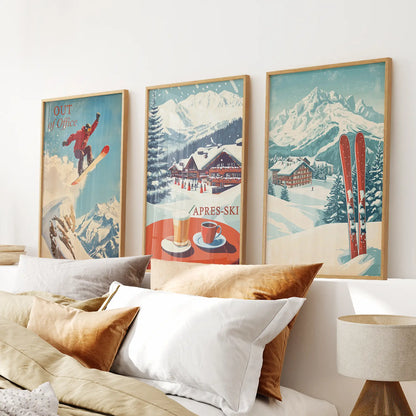 Vintage ski wall art set of 3 with snowboarder and alpine chalet. Thinwood frames above the bed.