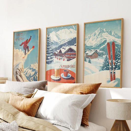 Vintage ski wall art set of 3 with snowboarder and alpine chalet. Thinwood frames above the bed.