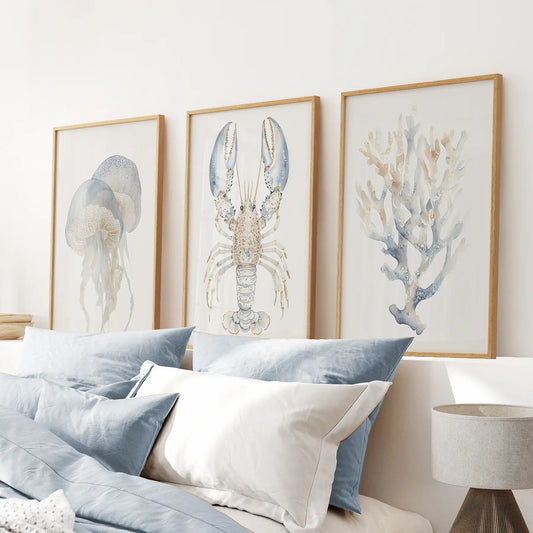 Nautical poster summer cottage wall art. Trendy room decor. Thinwood frames above the bed.