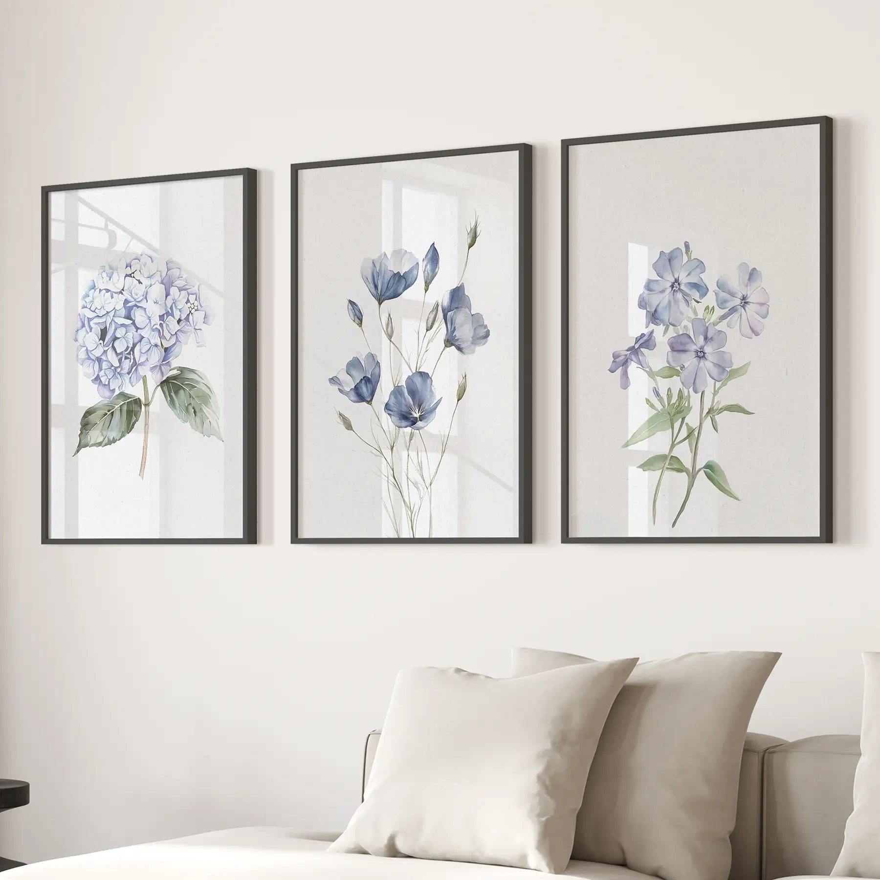 Set of 3 blue watercolor hydrangea prints, floral decor. Black frames above the Sofa.