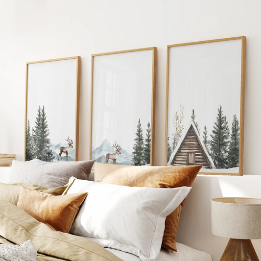 Rustic winter cabin and deer wall art set. Winter holiday wall art set. Thinwood frames above the bed.