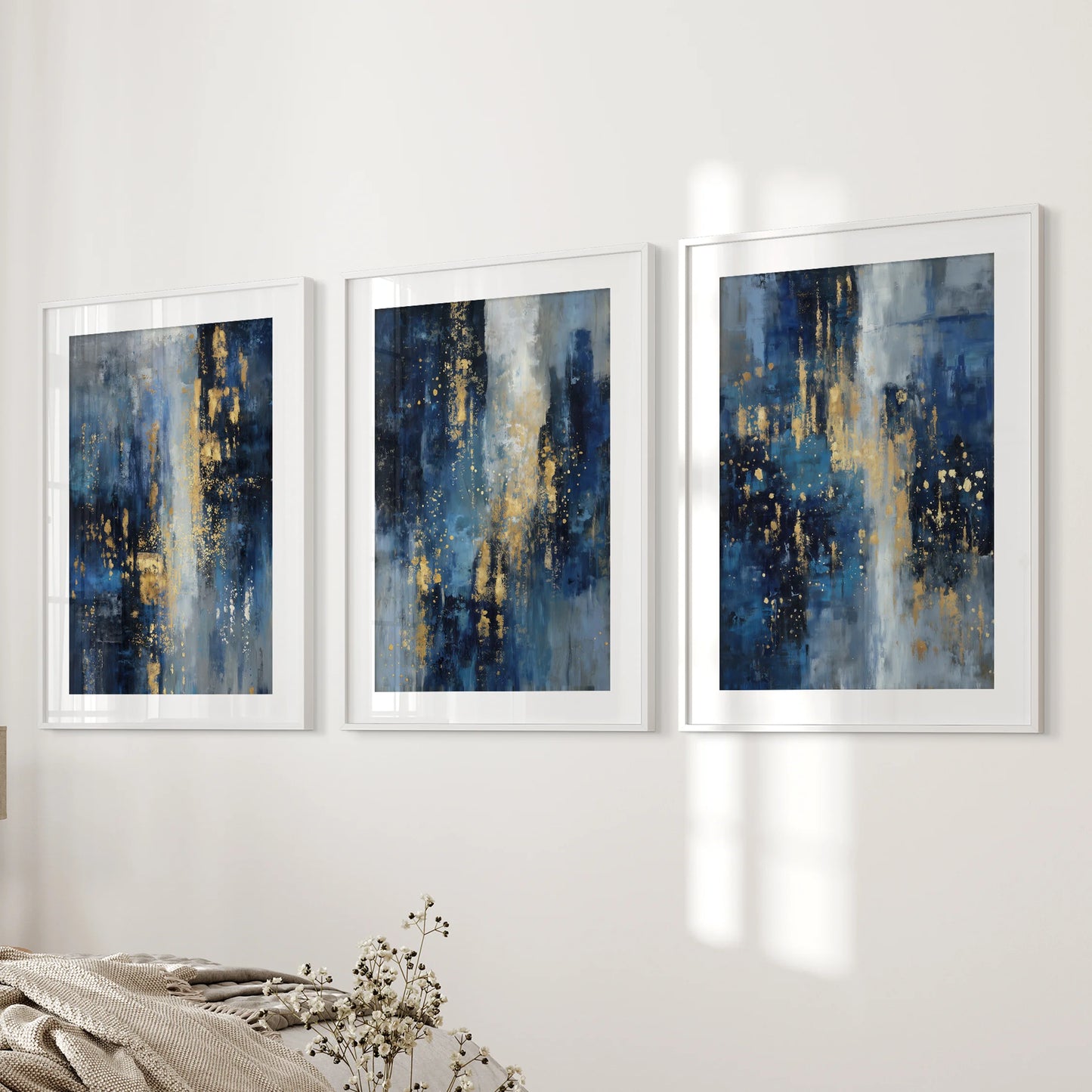 Navy blue and gold abstract brushstrokes, 3-piece wall decor set, in white matted frames gracing the bedroom wall with a refined, modern touch.