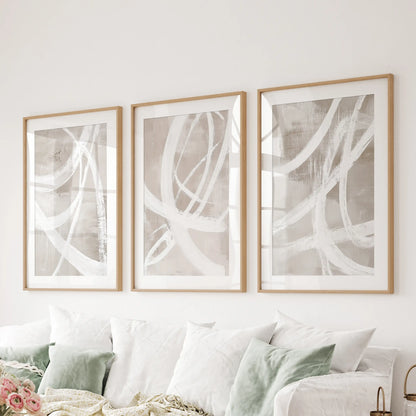 Modern abstract forms wall hanging, set of 3 matted in natural oak, anchors the living room over the couch with understated texture.