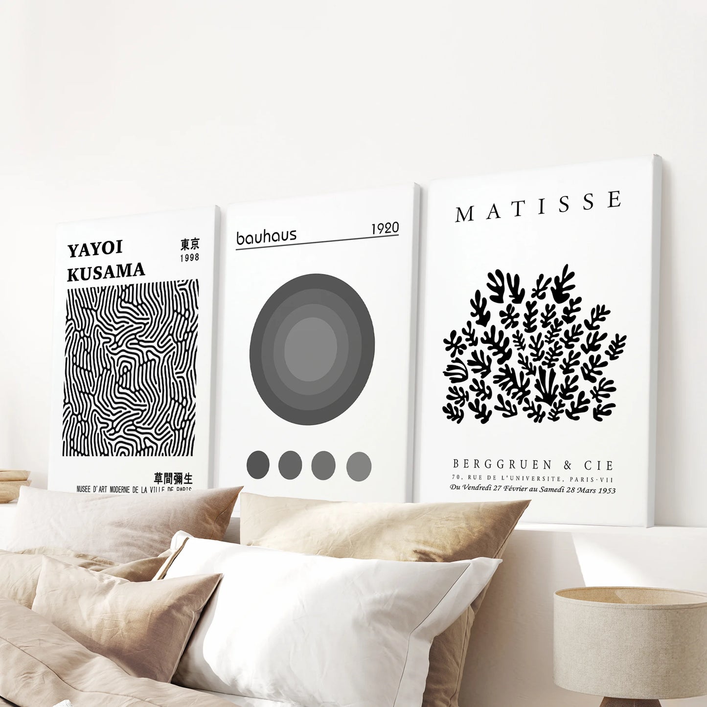 Trio of abstract canvas art prints hangs above the bed, lending the bedroom gentle organic forms and a modern gallery touch.