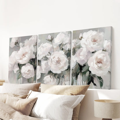 White peonies as a set of three canvas wall art prints, spanning above the bed to layer the bedroom with textured petals and gentle, modern romance.