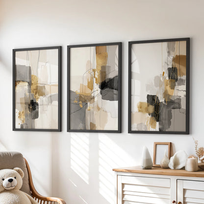 Three acrylic-texture wall panels in matte-black frames fill the kids playroom above the chest of drawers with bold but quiet shapes.