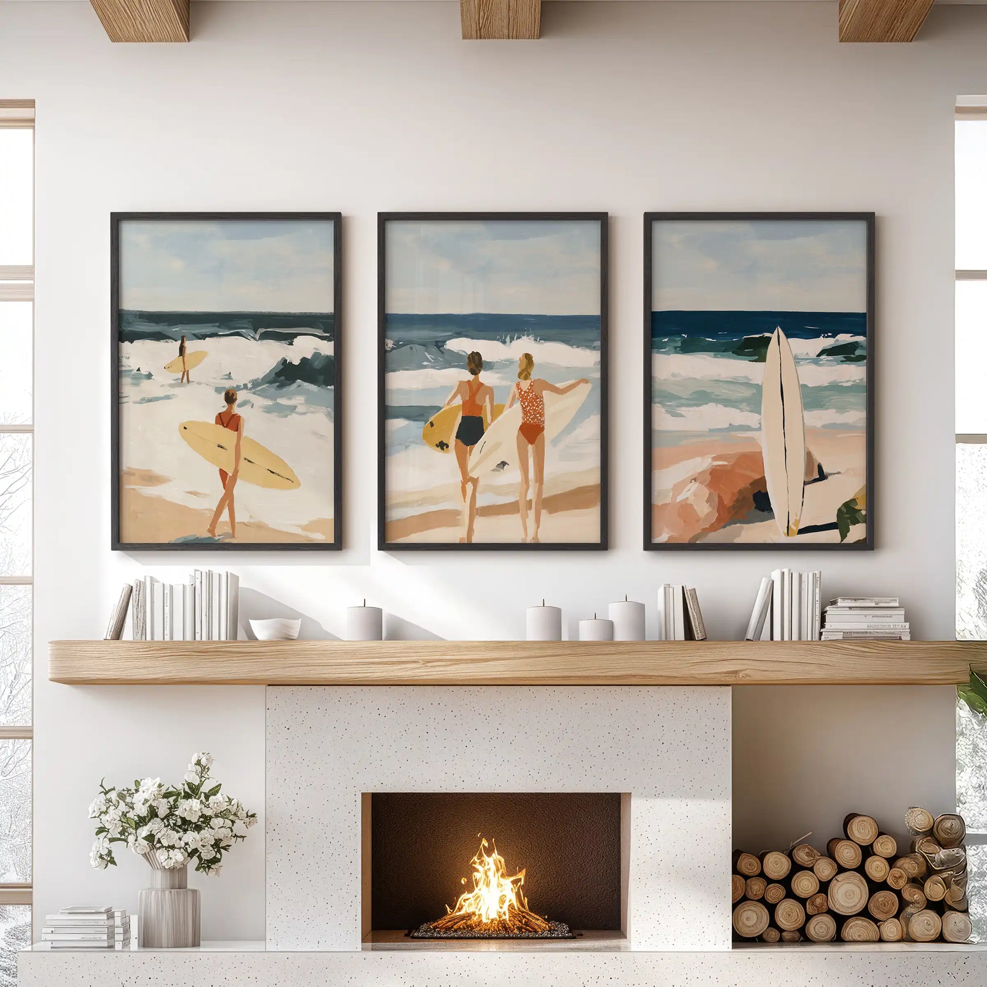 A trio of black-framed surfer girl prints hangs above the sitting-room mantle, lending crisp coastal lift and breezy ease to the wall.