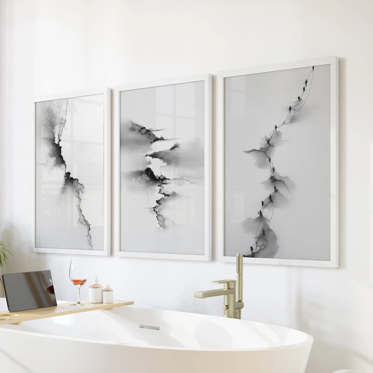 This abstract three-piece wall art set in crisp white frames floats over the soaking tub, lending a serene, spa-like tone.