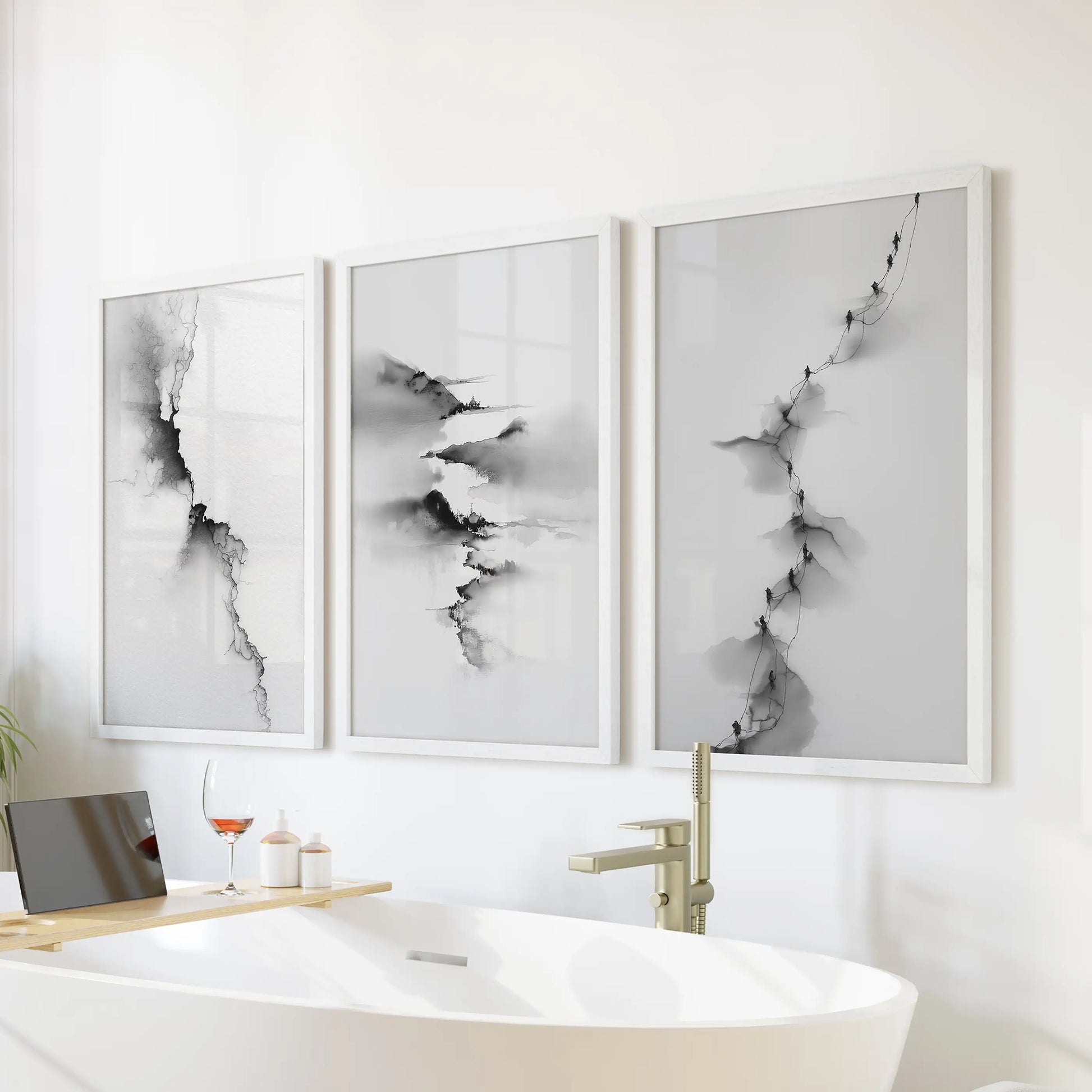 This abstract three-piece wall art set in crisp white frames floats over the soaking tub, lending a serene, spa-like tone.