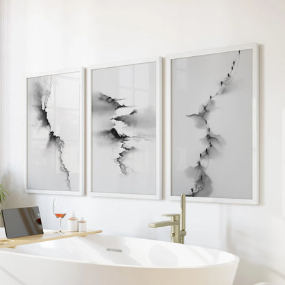 This abstract three-piece wall art set in crisp white frames floats over the soaking tub, lending a serene, spa-like tone.