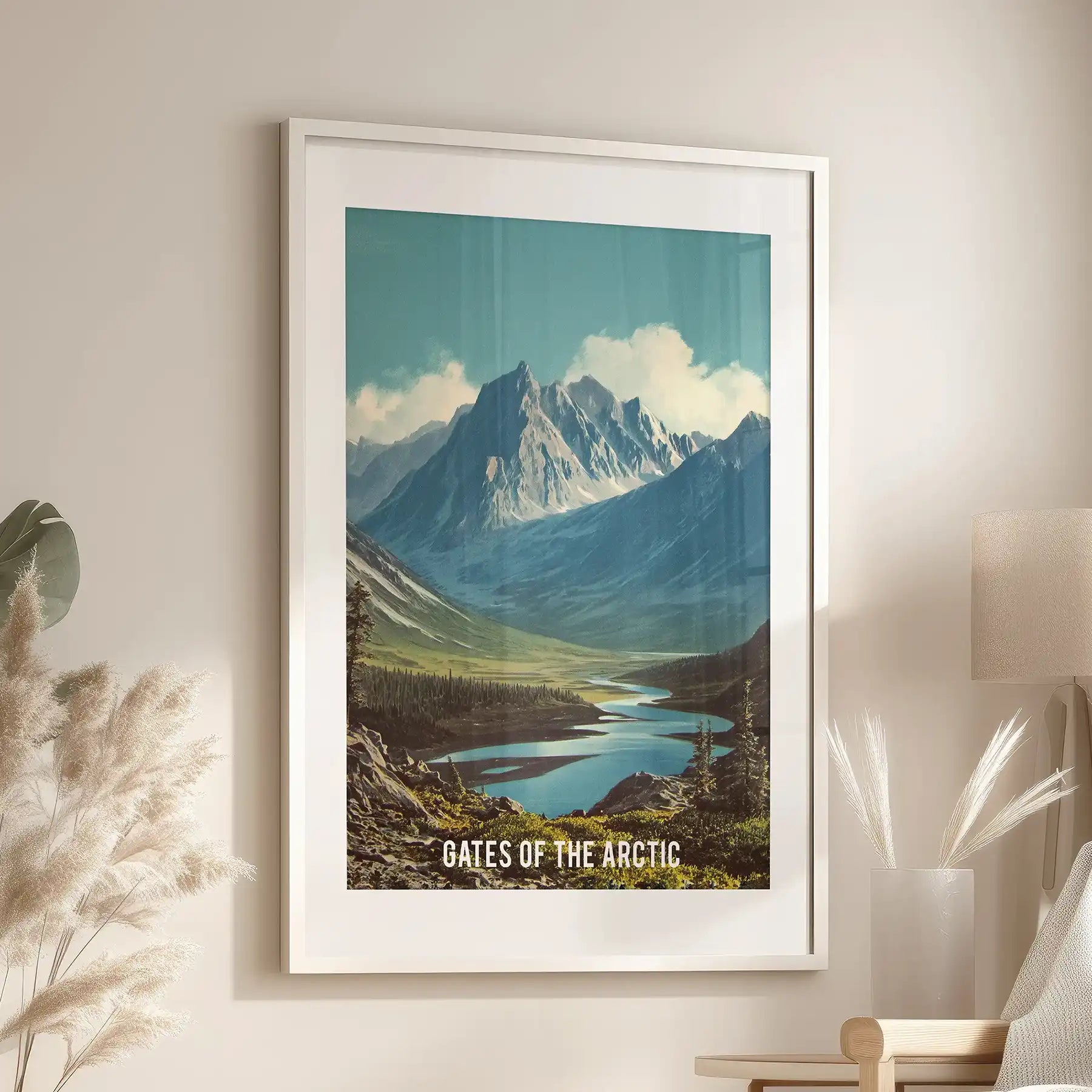 Alaska mountain scenery artwork comes as a white matted framed print, styled near the family-room reading chair to bring crisp, outdoor energy inside.