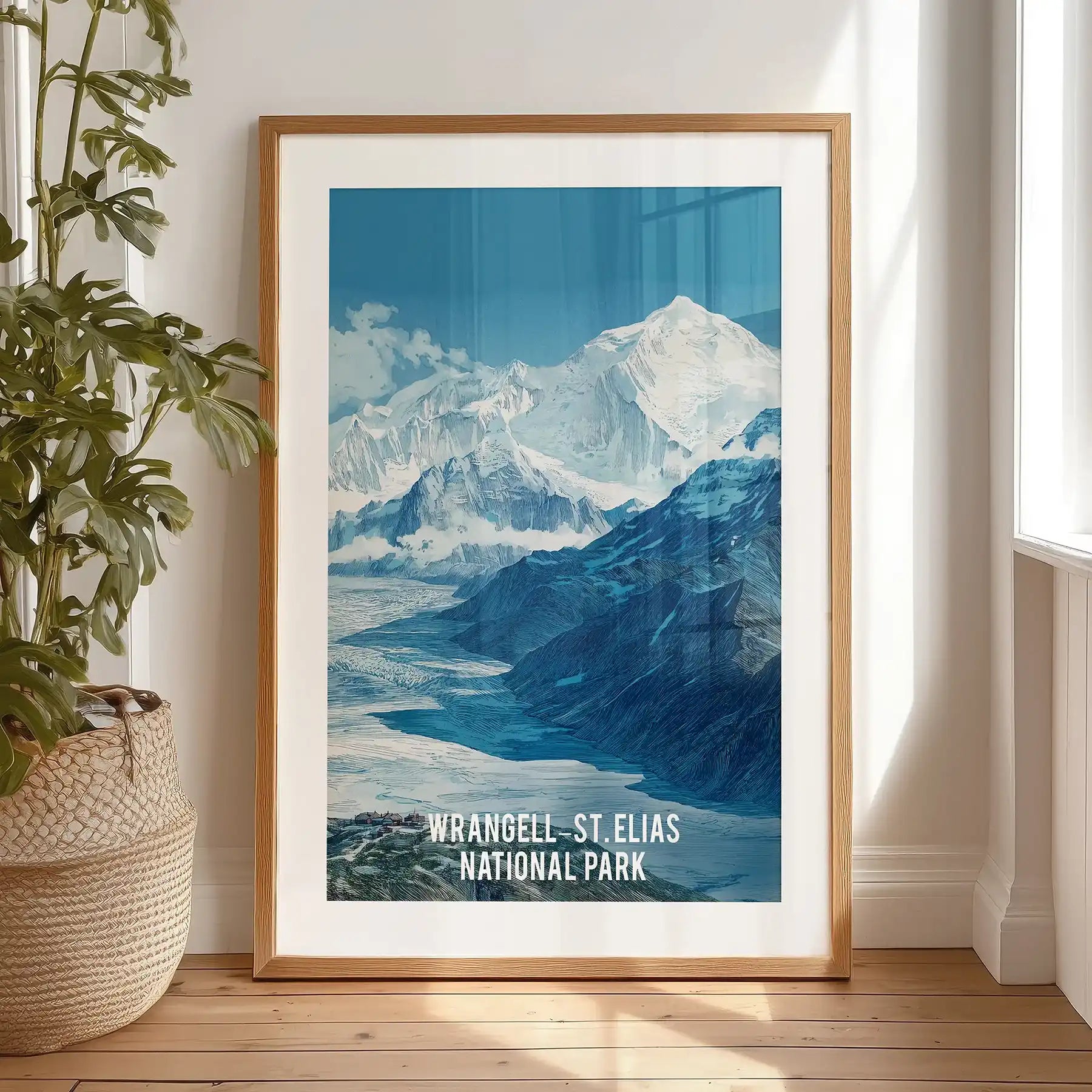 Wrangell-St. Elias National Park artwork for wall, black-framed with matting, rests against the bedroom wall on the floor, bringing stark glacier drama to a calm space.