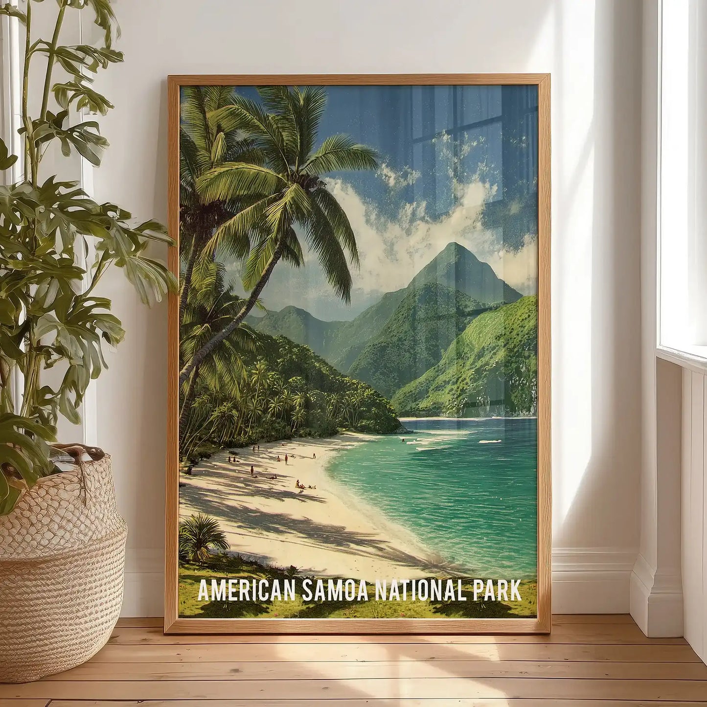 American Samoa coastline decorative art print in an oak wood frame, placed on the bedroom floor to lean casually, brings island blues and deep greens indoors.