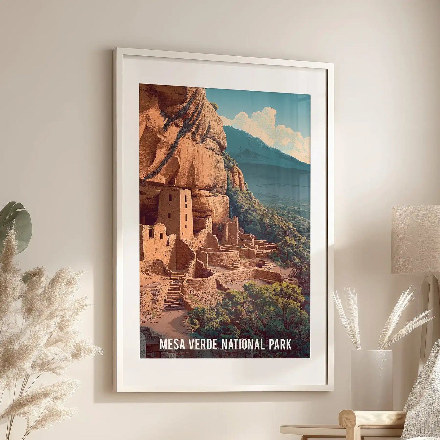 Native American stone structures art print for wall lends quiet history to the sitting room above an accent chair, framed in white with a matching mat.
