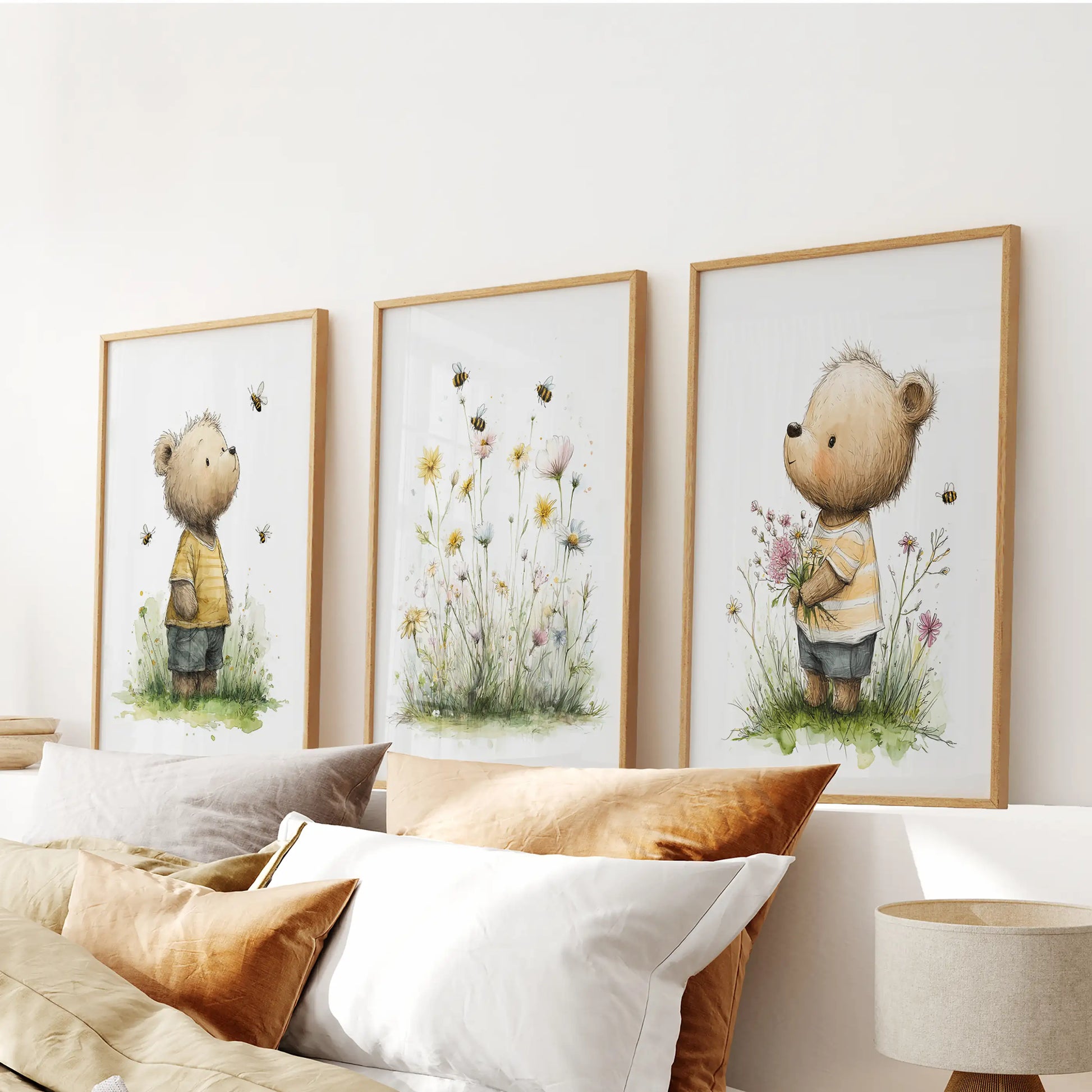 Set of three floral baby animal art prints in wood frames creates a gentle wall art feature over the bed’s headboard in the bedroom.