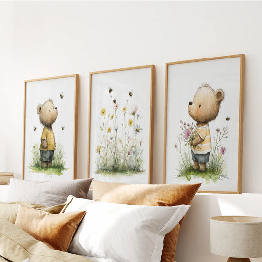 Set of three floral baby animal art prints in wood frames creates a gentle wall art feature over the bed’s headboard in the bedroom.