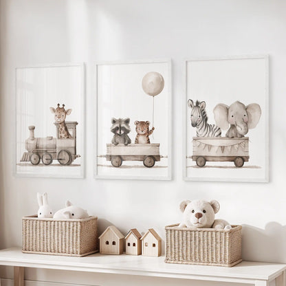 Three animal train prints in white frames above a toy storage bench.