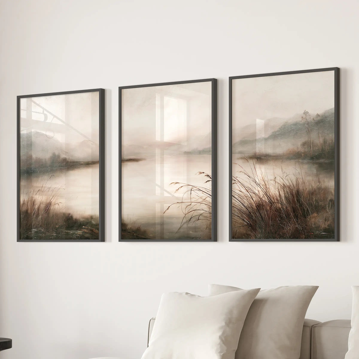 Three-piece wall art set featuring an antique nature scene in black frames, arranged above a lounge sectional.