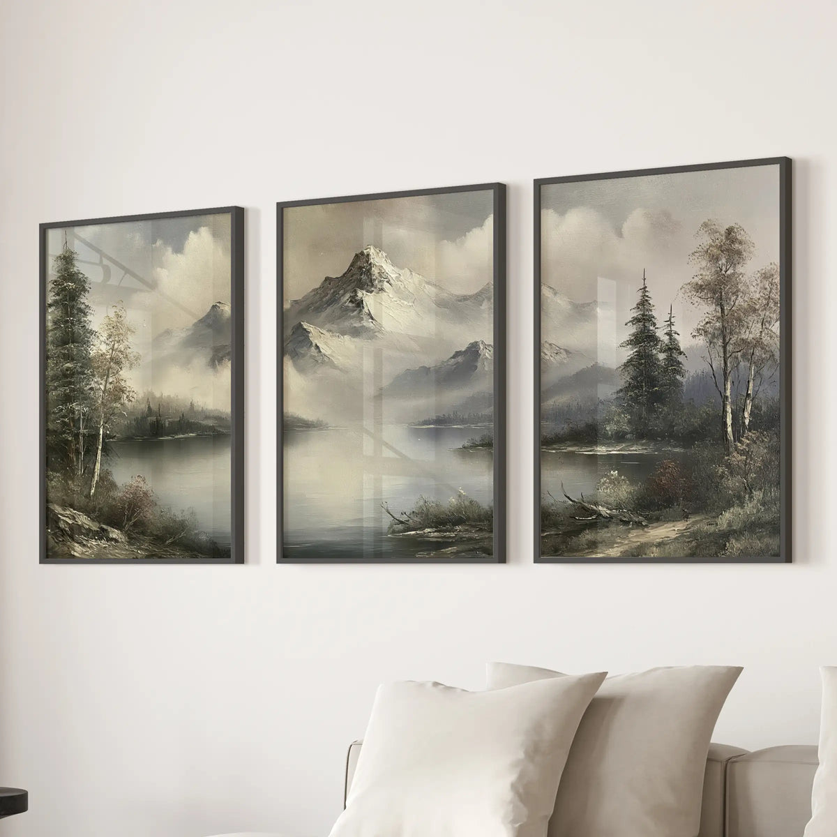 Antique wilderness landscape three-piece wall hanging set in black frames, displayed behind a sofa in a living room.