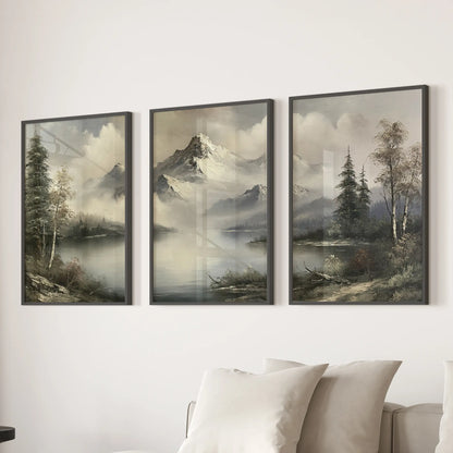 Antique wilderness landscape three-piece wall hanging set in black frames, displayed behind a sofa in a living room.