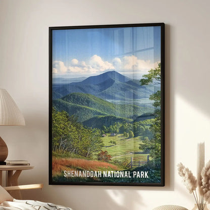 A framed wall art piece of Shenandoah National Park, set in black, hangs above a lounge seating area, giving the room an open mountain view.
