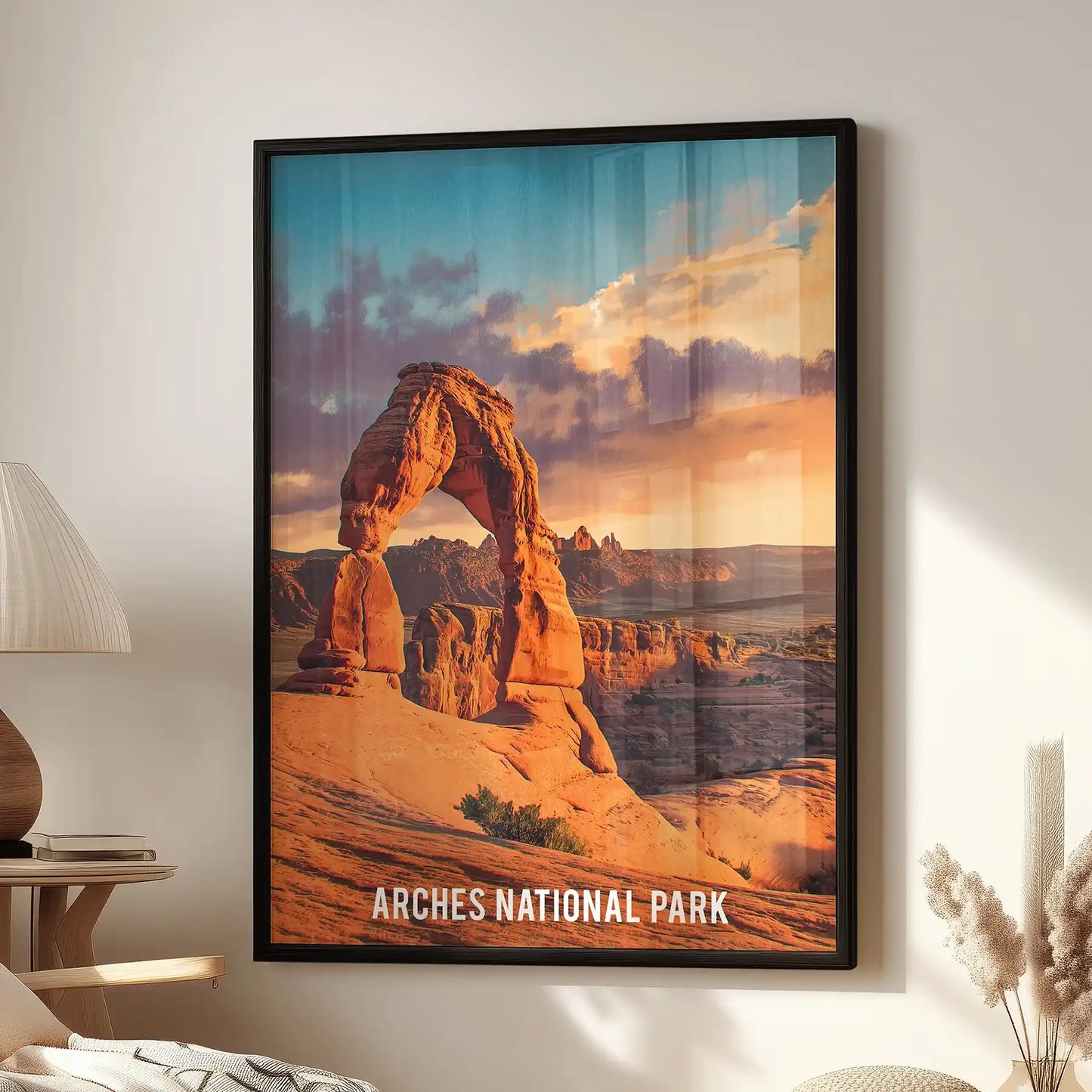 A black-framed Delicate Arch wall art print hangs above a cozy chair in the living room, curating Utah’s red-rock drama with modern warmth.