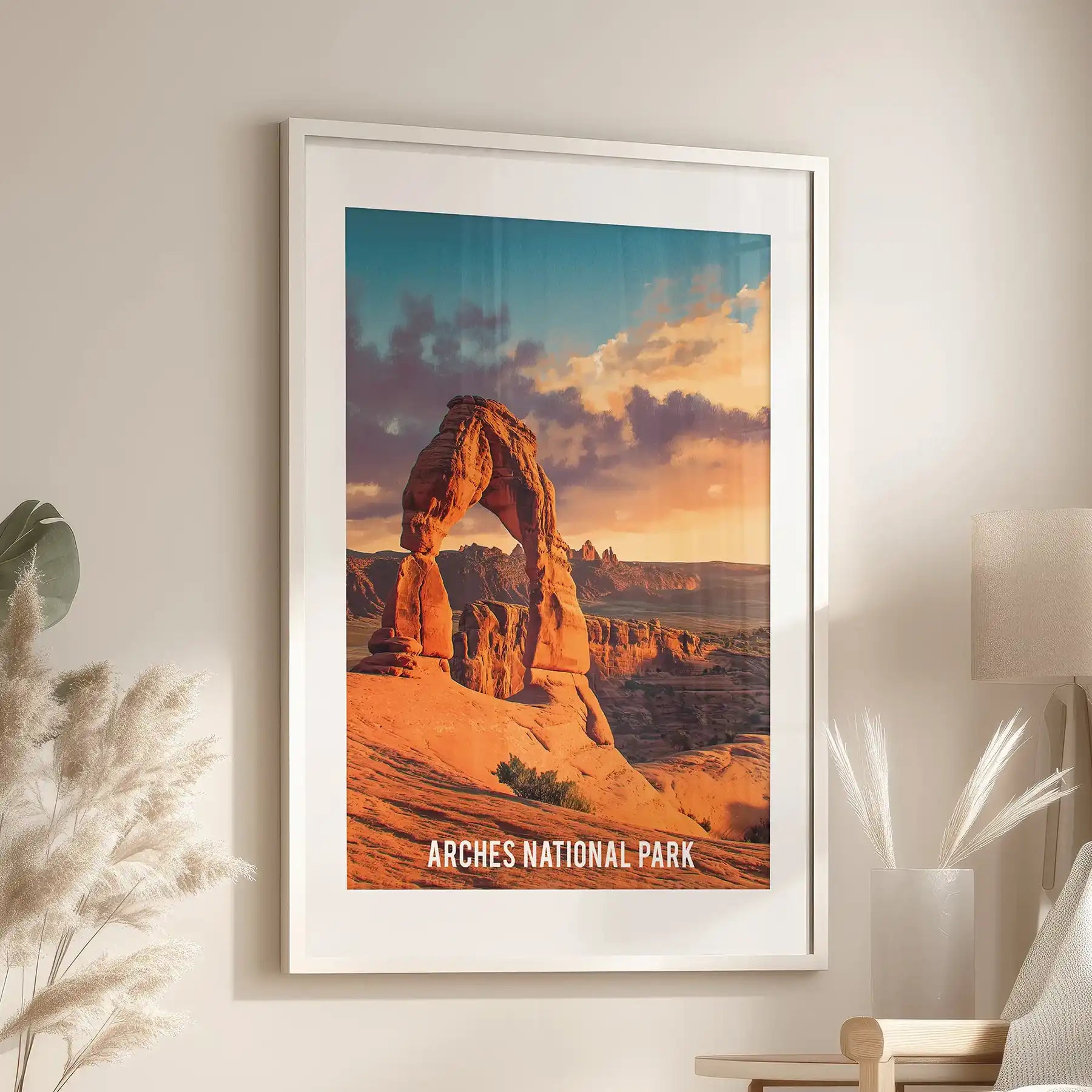 Sandstone arches decorative art print in a white frame with mat warms the lounge, hanging above the seating area with sunlit reds and sculpted curves.