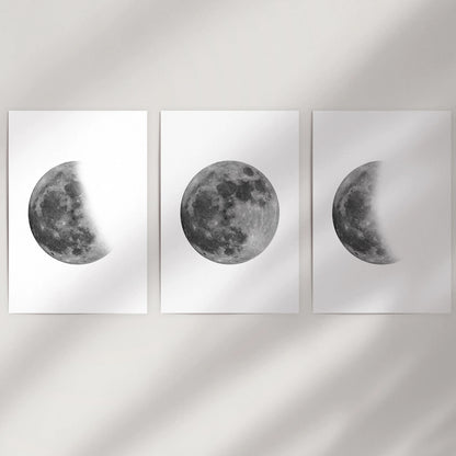 Black and white moon photography 3-piece print set, delivered as unframed posters to fill a blank wall with stark, space-toned lunar art.