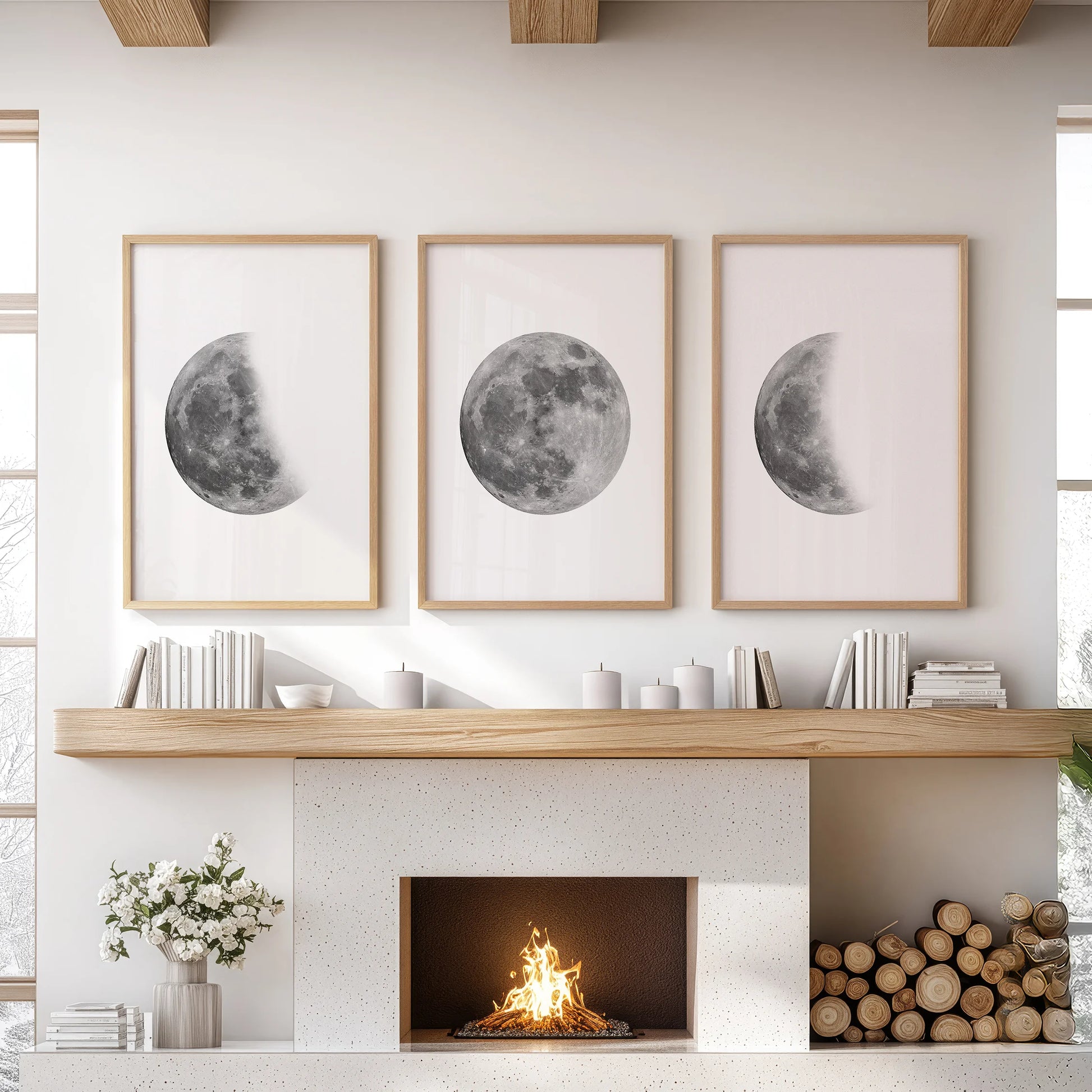 Three moon phase prints in warm wood frames line the space above the fireplace, giving the living room a steady sky-watching focus.