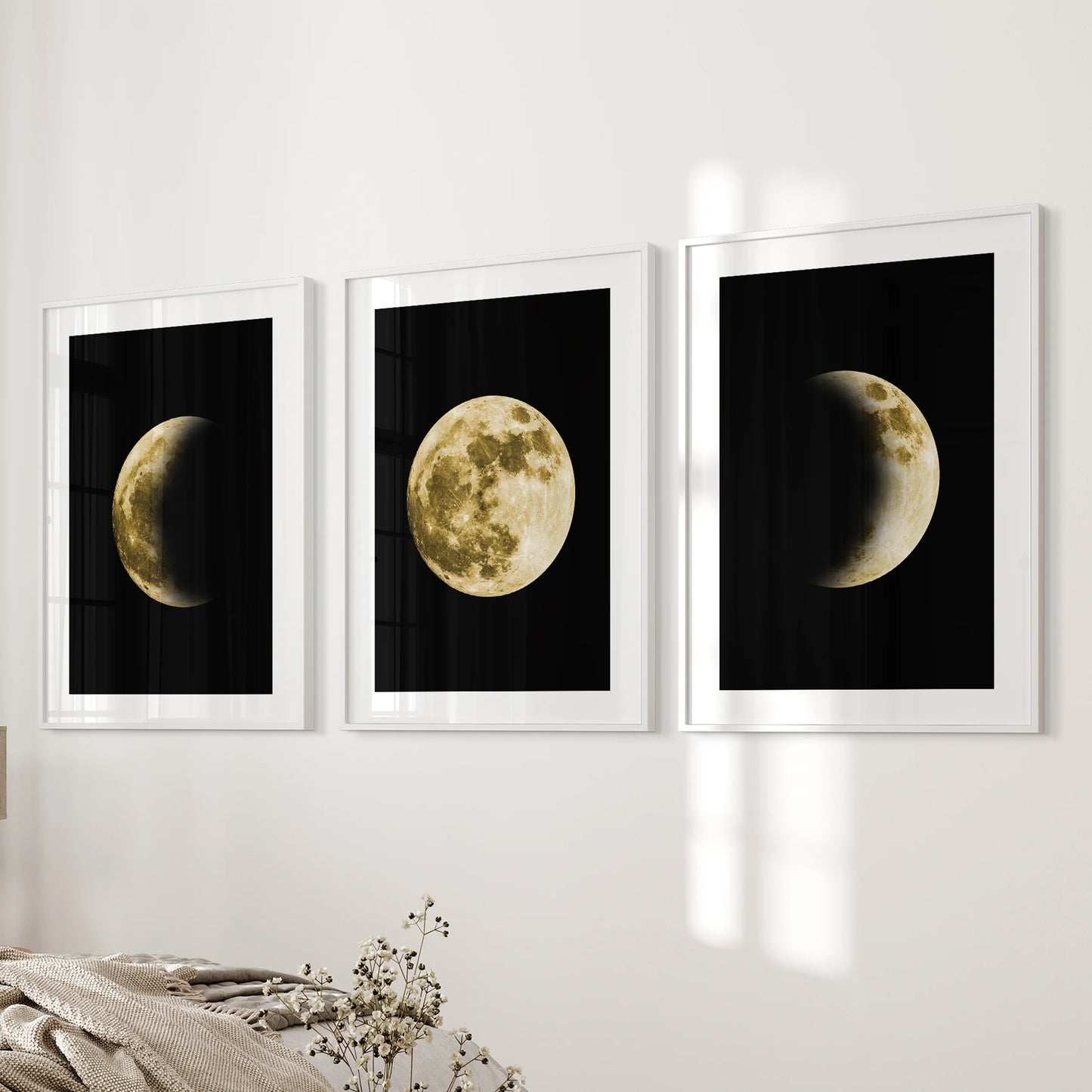 La Luna photo set, a 3 piece art set in white frames with matting, hangs on the wall beside the bed to bring refined lunar art to the bedroom.