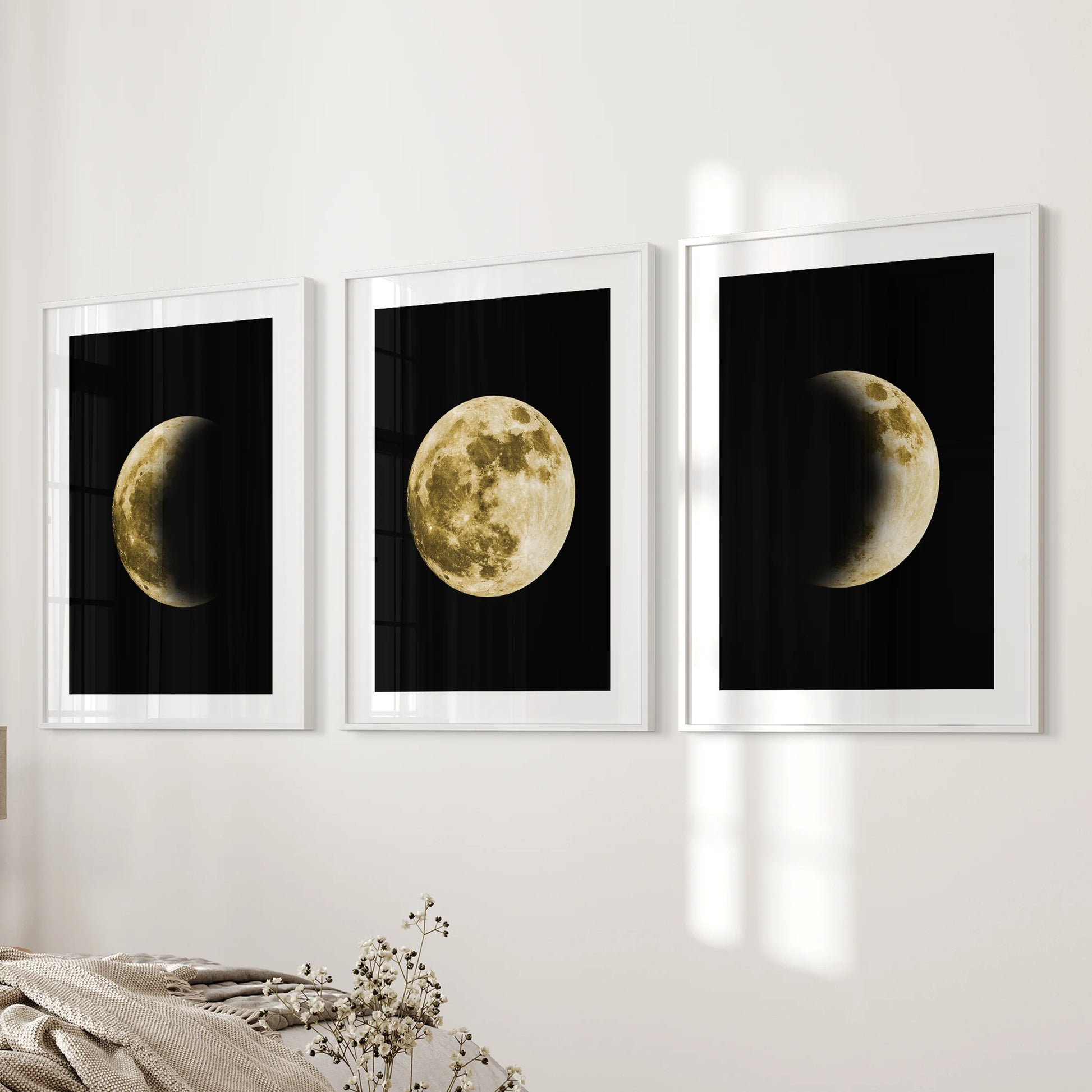 La Luna photo set, a 3 piece art set in white frames with matting, hangs on the wall beside the bed to bring refined lunar art to the bedroom.