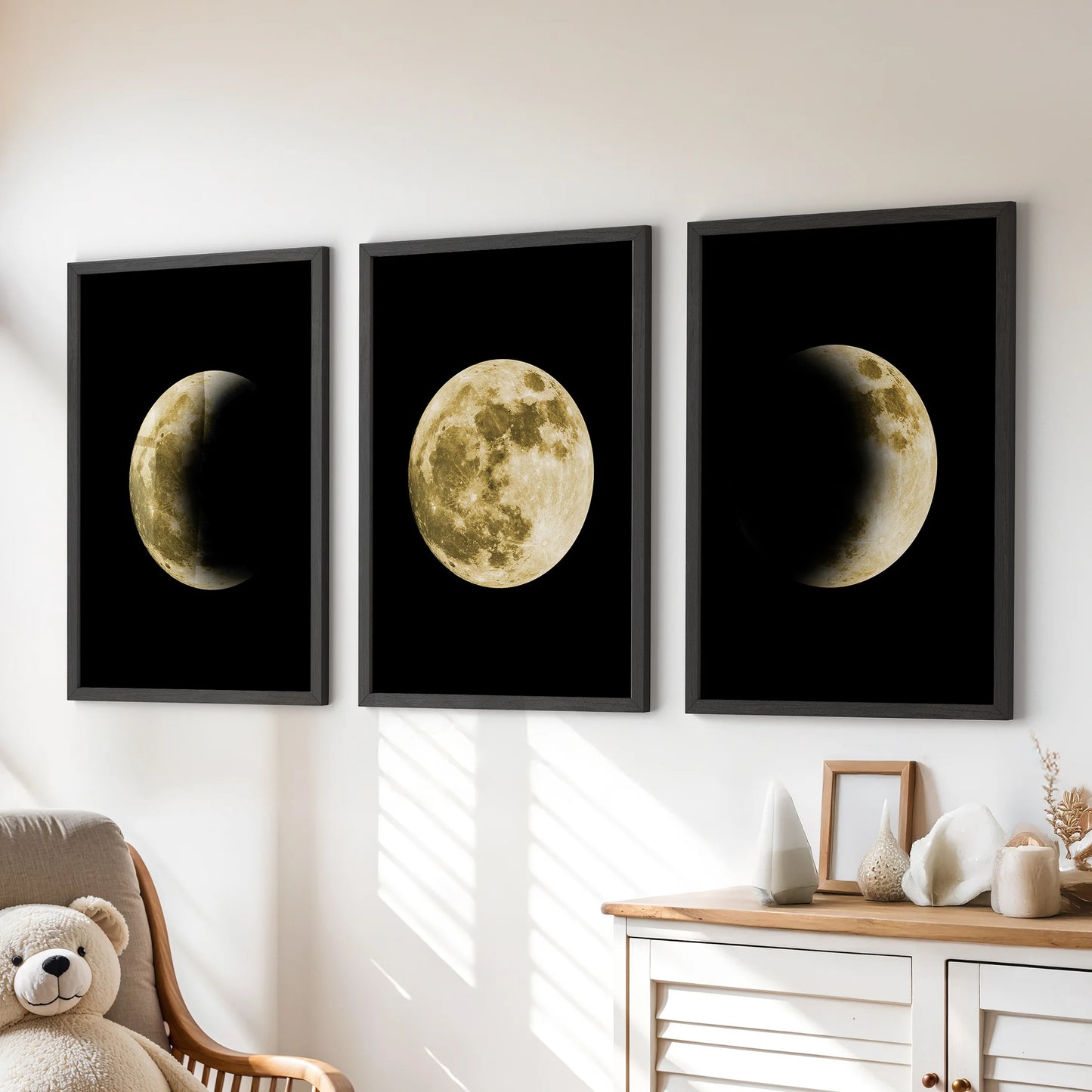 Moon surface textures, a wall art set of three with sleek black frames, sit above the dresser in a children's room, sparking gentle curiosity.