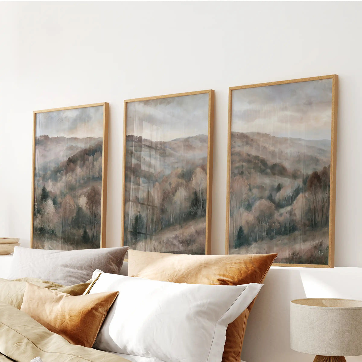 Soft watercolor woods wall art forms a 3-print set above the bedroom headboard, framed in thin wood for a quiet, airy finish.