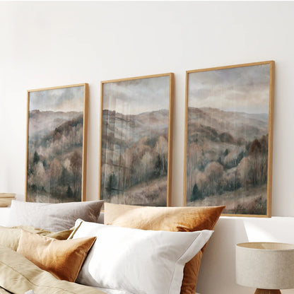 Soft watercolor woods wall art forms a 3-print set above the bedroom headboard, framed in thin wood for a quiet, airy finish.