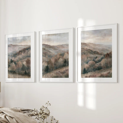 Autumn forest landscape art prints, a set of 3, line the bedroom wall beside the bed in white-matted frames for a cozy, balanced focal point.