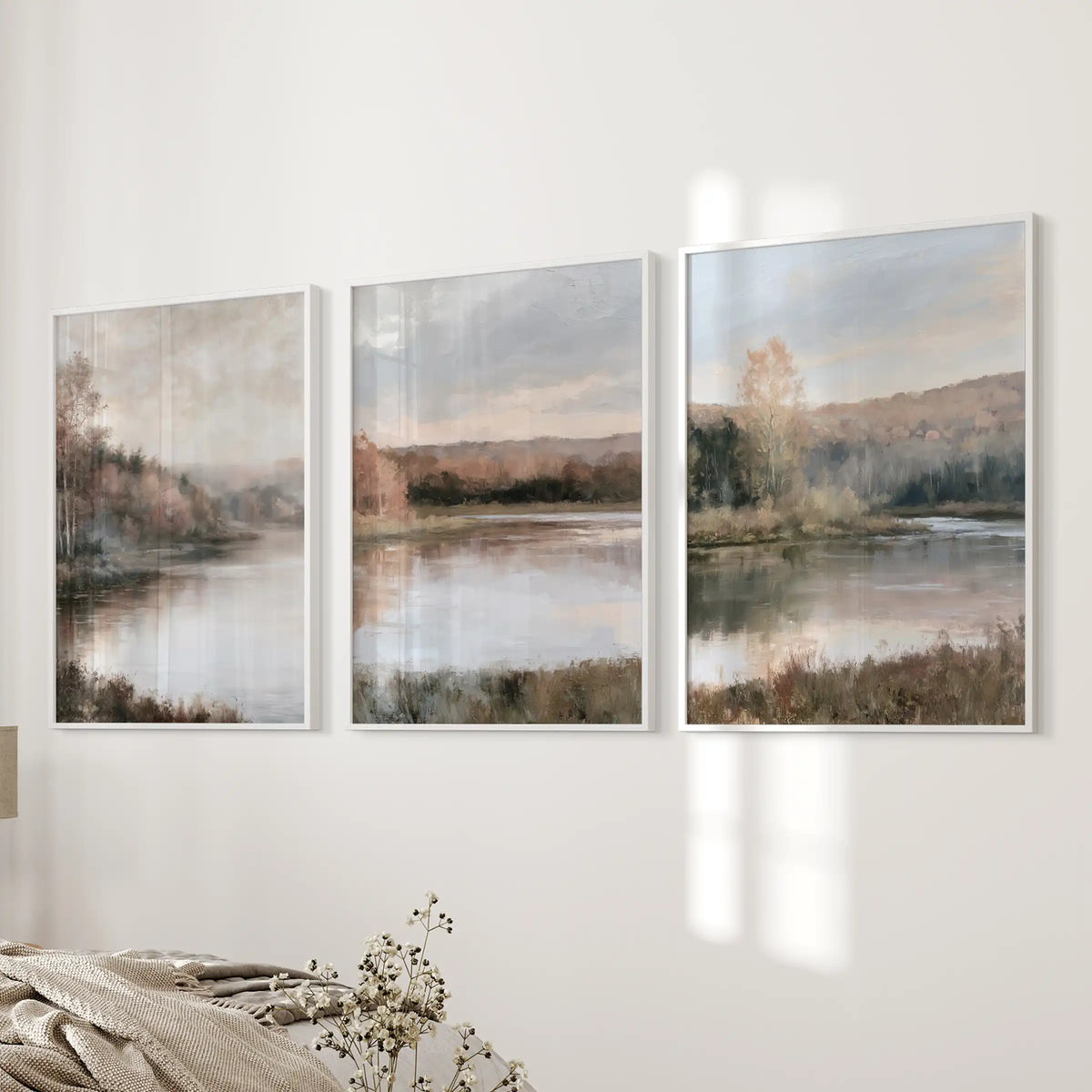 Lakeside forest scenes, a 3 pc wall art set in clean white frames, align on the bedside wall to bring soft, misty greens and golds into the bedroom.