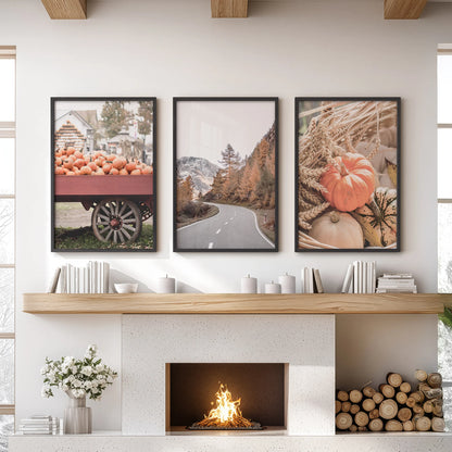 Three black-framed art prints of autumn trees bring crisp color above the fireplace mantel, aligning the lounge wall with an easy, balanced rhythm.