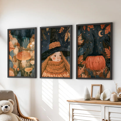 A storybook cottagecore forest fills this three-piece wall art set, hung in black frames over the dresser in a children's room.
