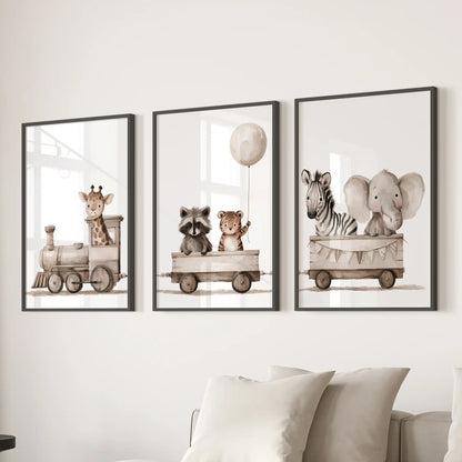 A set of three prints in black frames shows an animal train with a balloon over the middle car above a sofa.