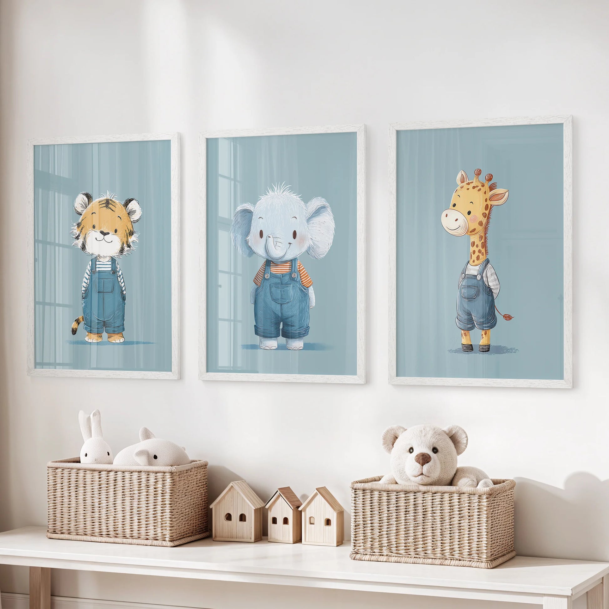 Giraffe, tiger, and elephant trio, three coordinated wall art prints in white frames, brightening a kids room with calm blue tones.