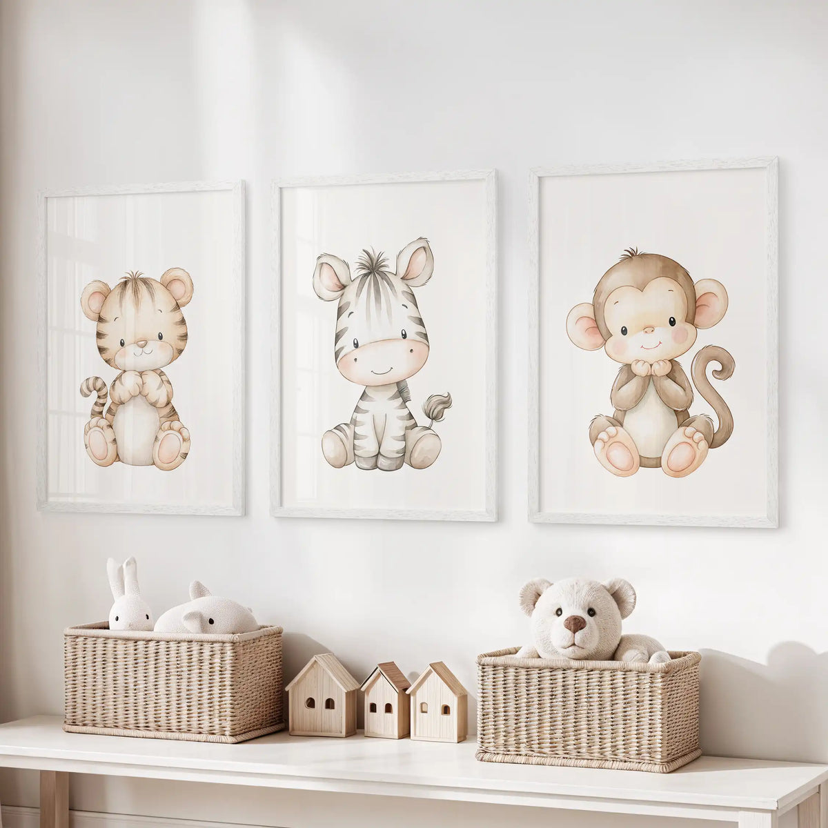 Above a toy storage bench, three white-framed prints show a tiger, zebra and monkey.