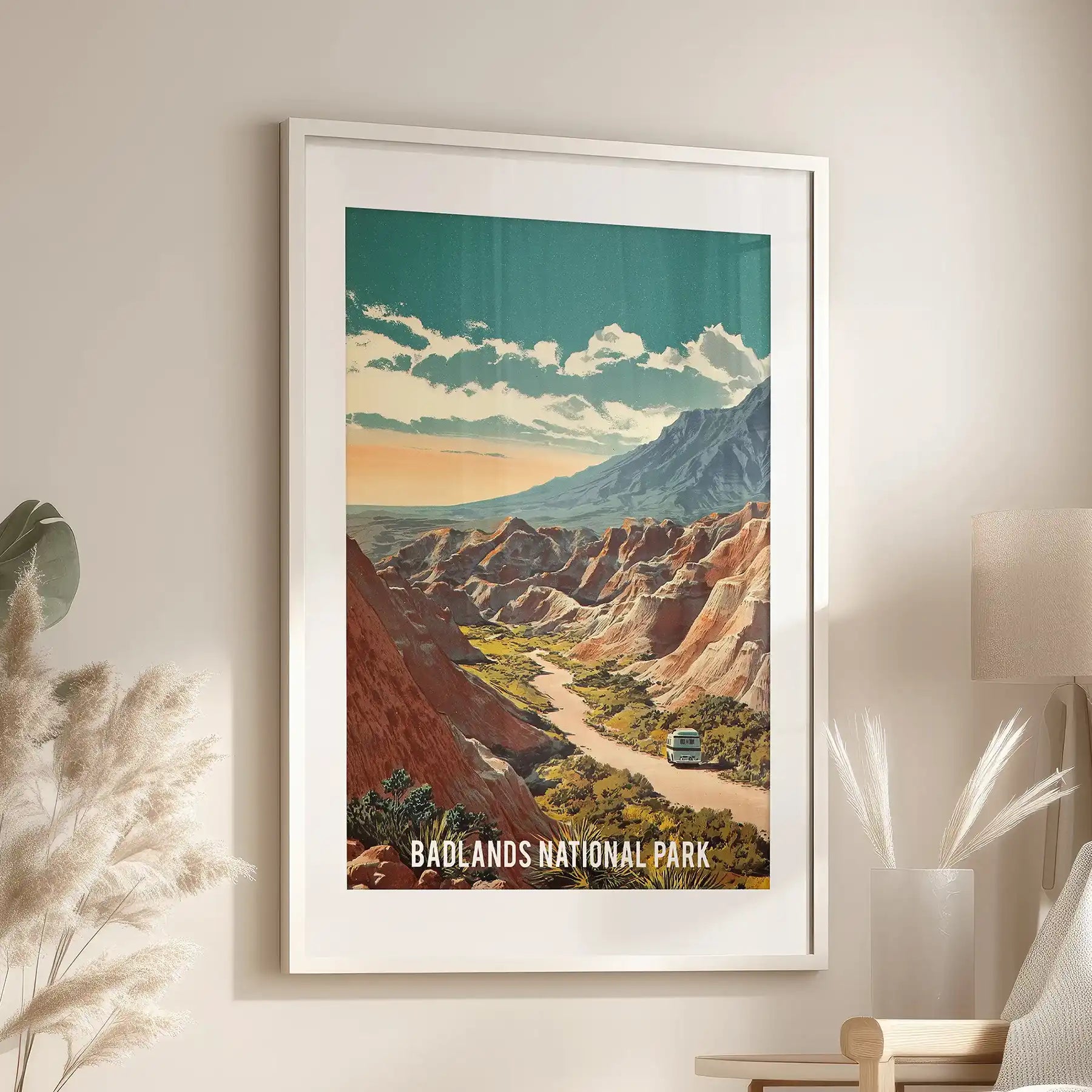 One-panel wall art of Badlands buttes and canyons brightens the sitting room, framed in white with a matching mat just over a cozy chair.