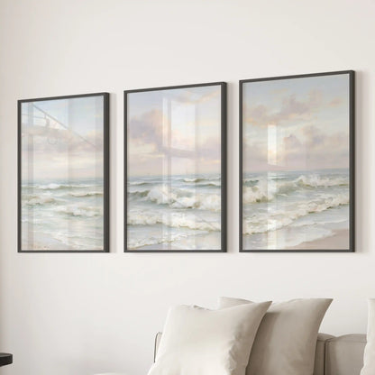 Sandy shoreline views, a set of three prints in sleek black frames, lend relaxed beach-house texture to the living room when displayed behind the couch.