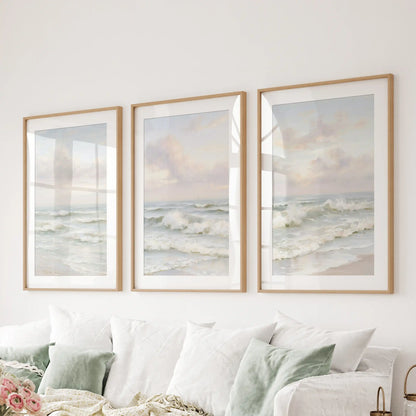A wooden-framed wall art trio with mats brings soft ocean rhythm and relaxed polish to the family room behind the couch.