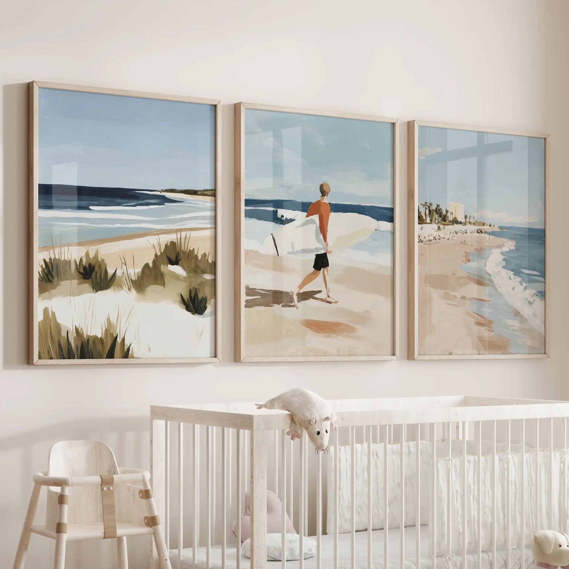 Surfer scenes, three wooden-framed prints, hover over the crib to add playful motion and soft ocean color to the baby room.